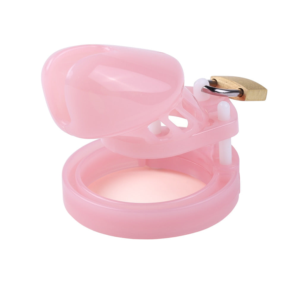 Embrace your femininity with our Pretty Pink Sissy cage! This molded plastic device securely padlocks your large cock, ensuring control and comfort. Its gold-toned pipe design feels like it's glued to you, enhancing your sissy desires.