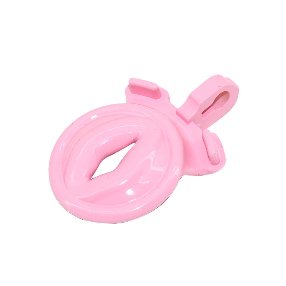 Embrace femininity with the Sissy Pink Clit Flat Cock cage. This silicone resin male device keeps you soft and discreet even on your knees or Mistress's lap. The clit-like pee hole adds excitement. Dripping with anticipation, experience the kiss of submission.