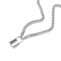 The Own Him Steel Chastity Necklace is a functional steel chastity device that he wears like jewelry. It looks like a sleek pod pendant, symbolizing unspoken connection and devotion, blending discreet style with profound meaning.