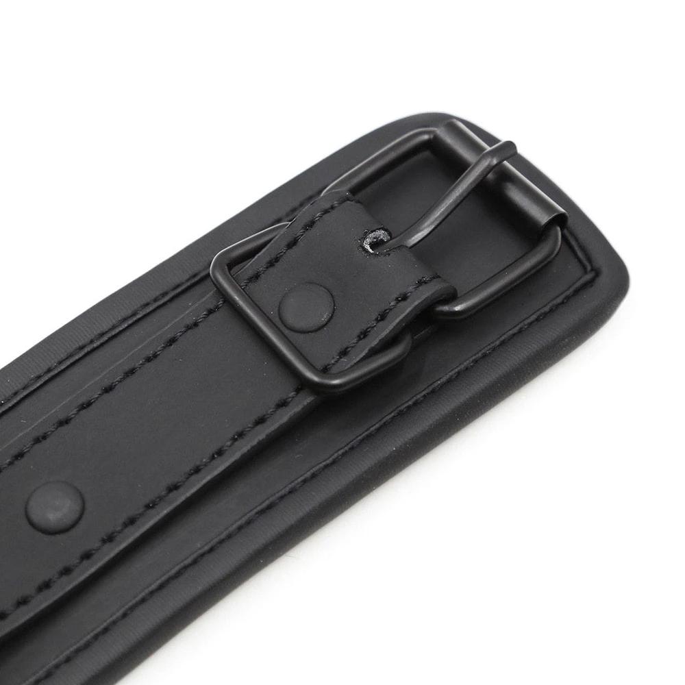 Embrace control with our Black BDSM Chastity Training Collar. Crafted from vegan leather for comfort, it offers secure enclosure and full coverage, challenging even a modern Houdini. Includes leash for added dominance.